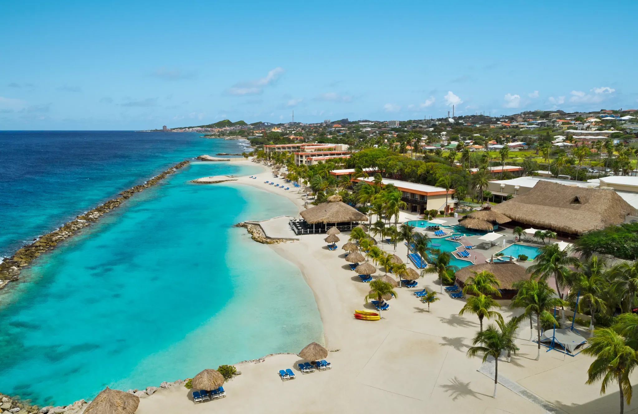 Aerial view of the private beach and turquoise Caribbean waters at Sunscape Curaçao Resort, Spa & Casino.