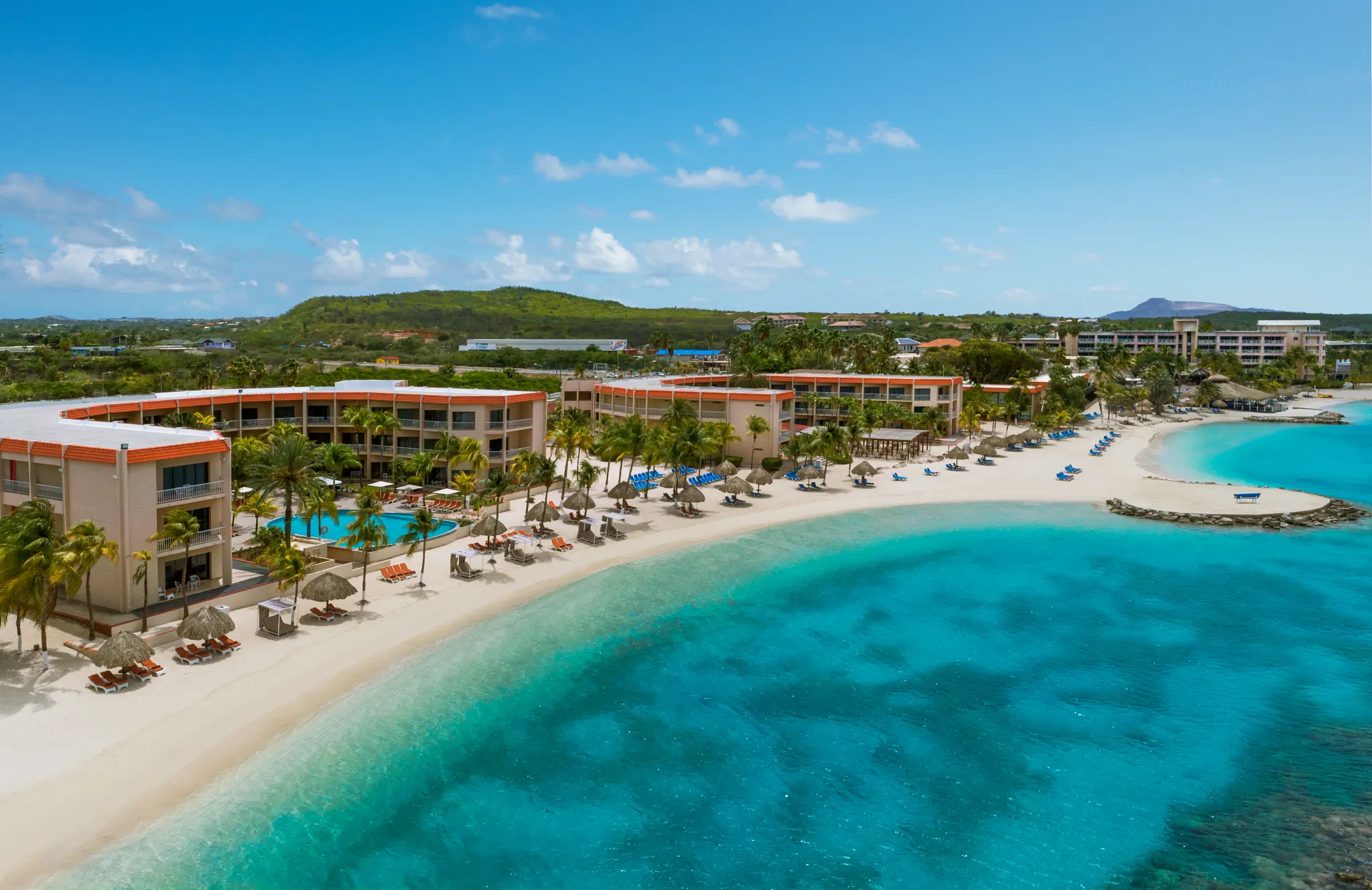 Beachfront rooms and sandy shoreline at Sunscape Curaçao Resort, Spa & Casino.