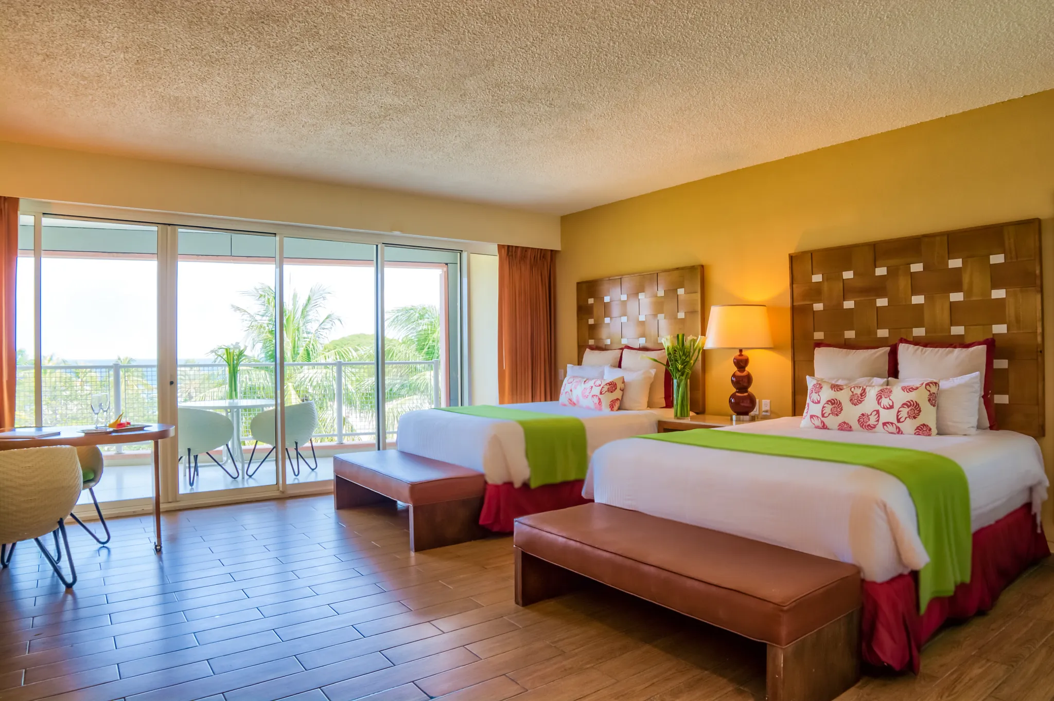 Deluxe Garden View room with two double beds and balcony at Sunscape Curaçao Resort, Spa & Casino.