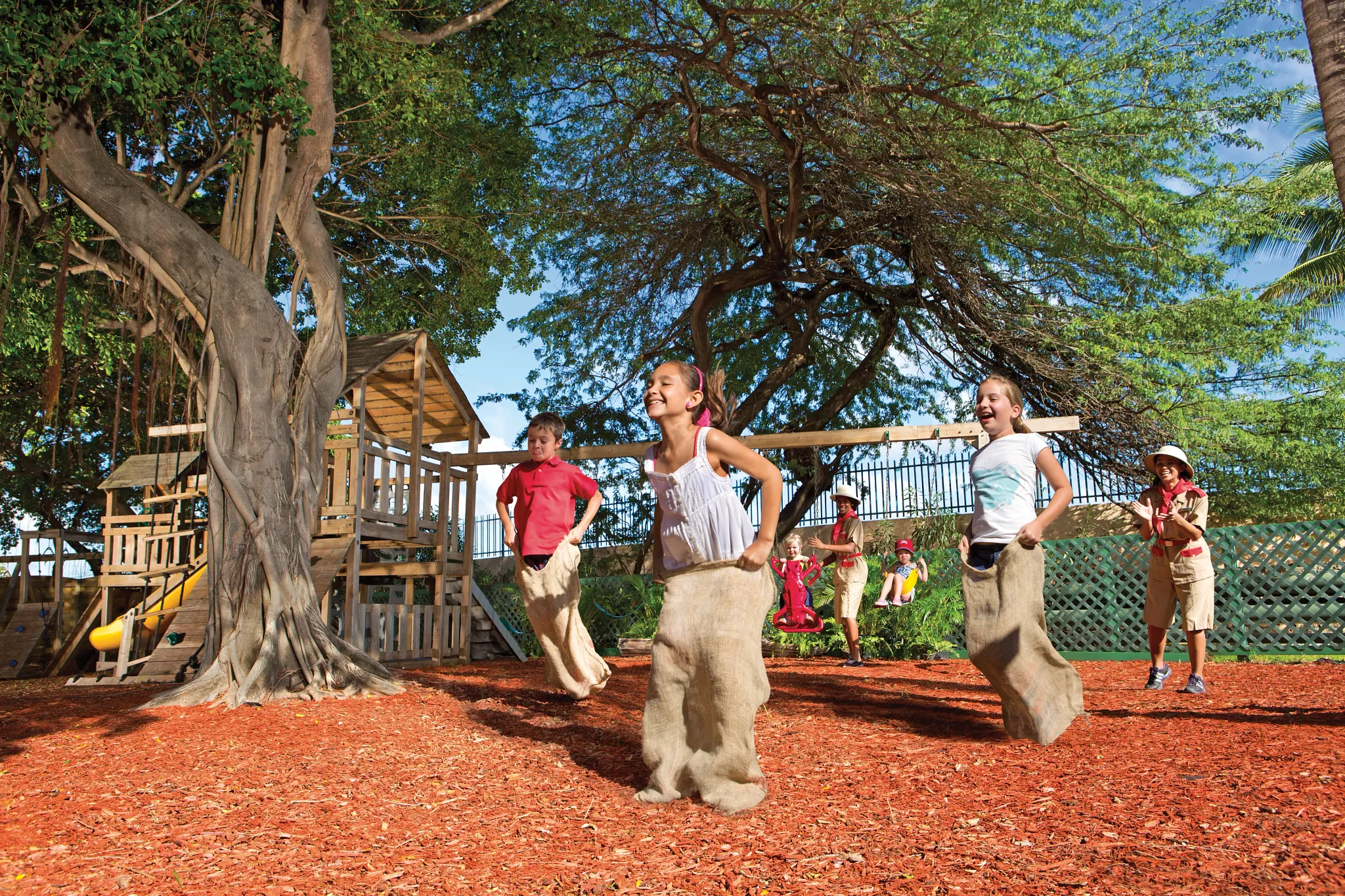 Kids participating in a sack race game at the Explorer’s Club at Sunscape Curaçao Resort, Spa & Casino.