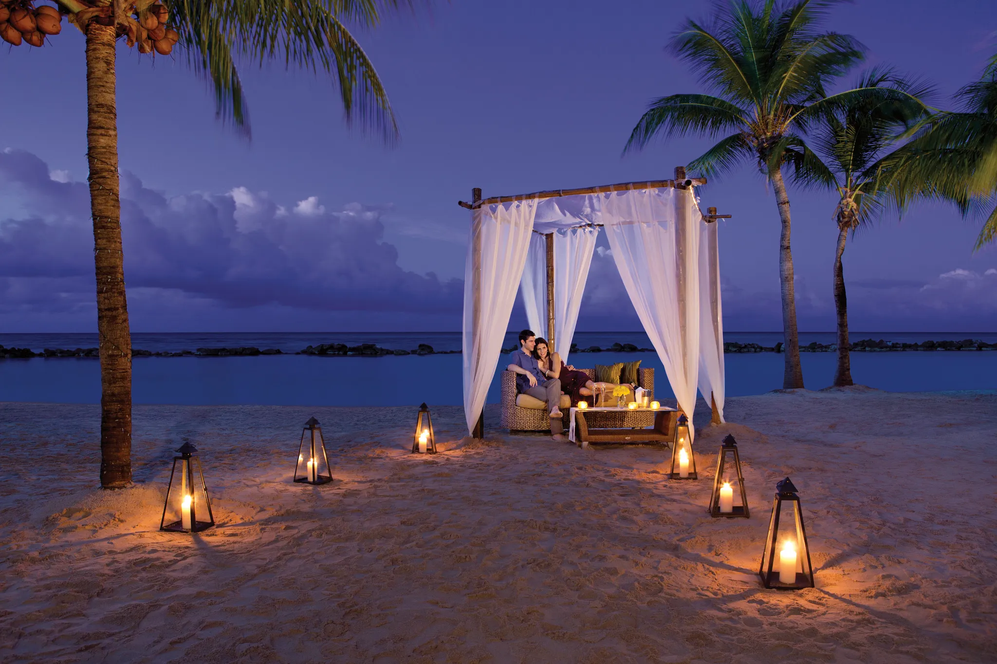 Private candlelit beach dinner cabana for couples at Sunscape Curaçao Resort, Spa & Casino.
