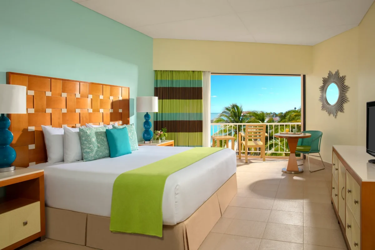 Sun Club Deluxe Ocean View king room with balcony and ocean view at Sunscape Curaçao Resort.