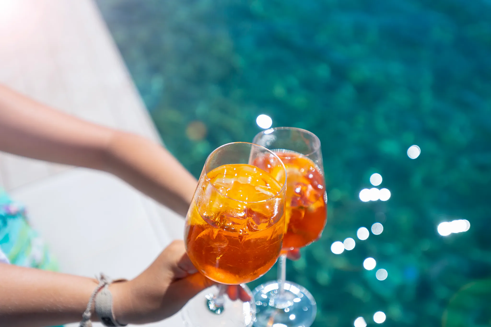 Sun Club Pool Bar drinks at Sunscape Curaçao Resort with tropical cocktails overlooking the turquoise Caribbean water.