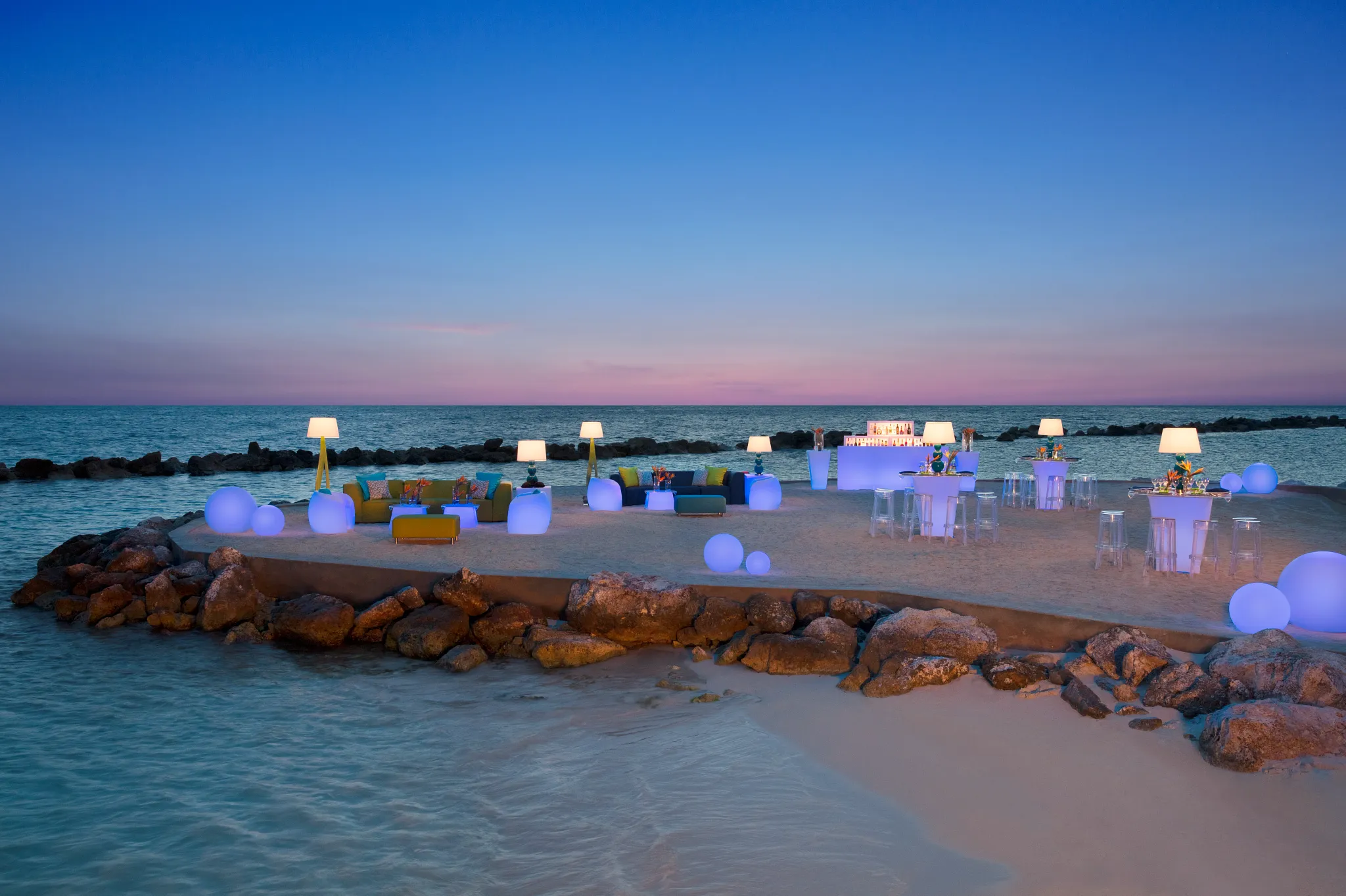Beach party reception setup with lounge seating at Sunscape Curaçao Resort, Spa & Casino